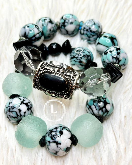 Aqua, black and white spotted glass, Recycled glass accents with Onyx inlaid brass focal bead